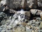 Creek running out of rock wall